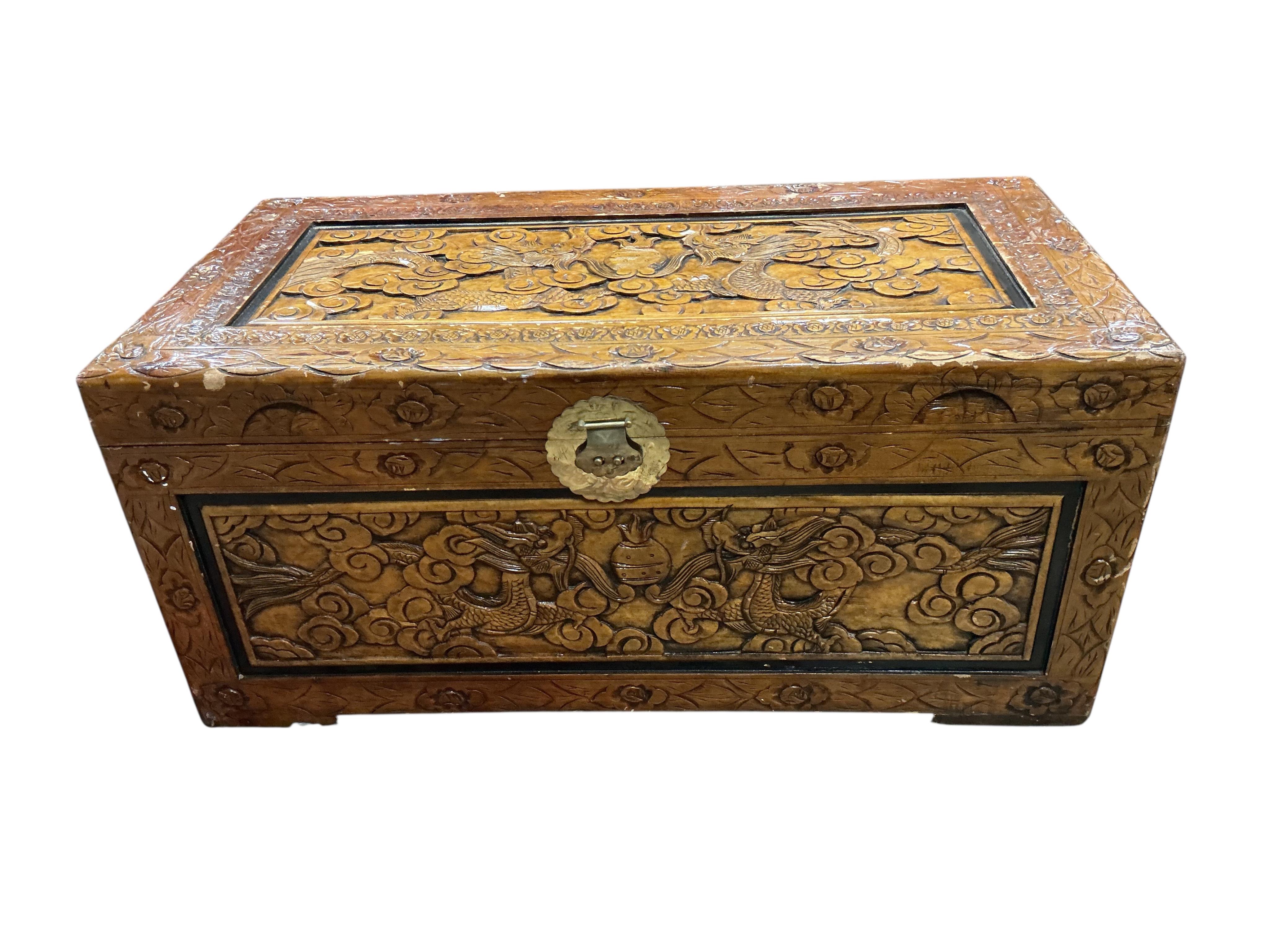 A Chinese carved camphorwood trunk, width 102cm, depth 51cm, height 45cm